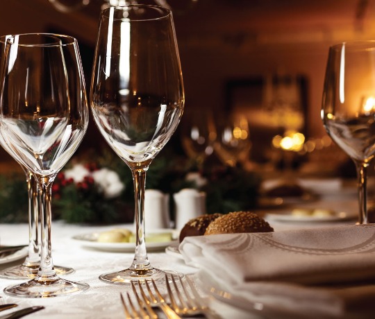 Highly polished glasses on a dining table in a restaurant