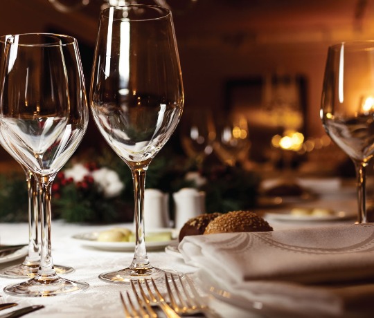 Highly polished glasses on a dining table in a restaurant